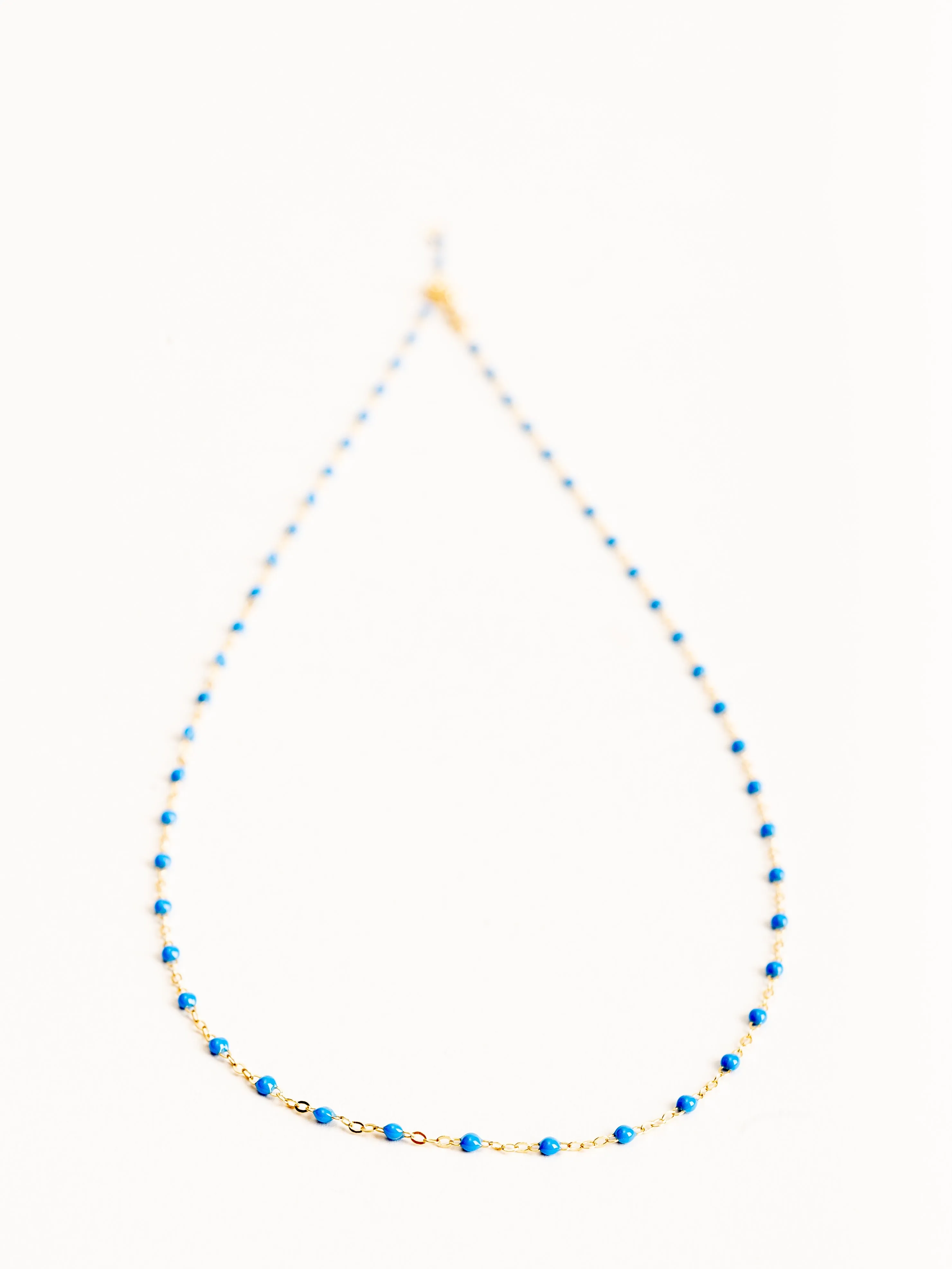 blue bead necklace- yellow gold