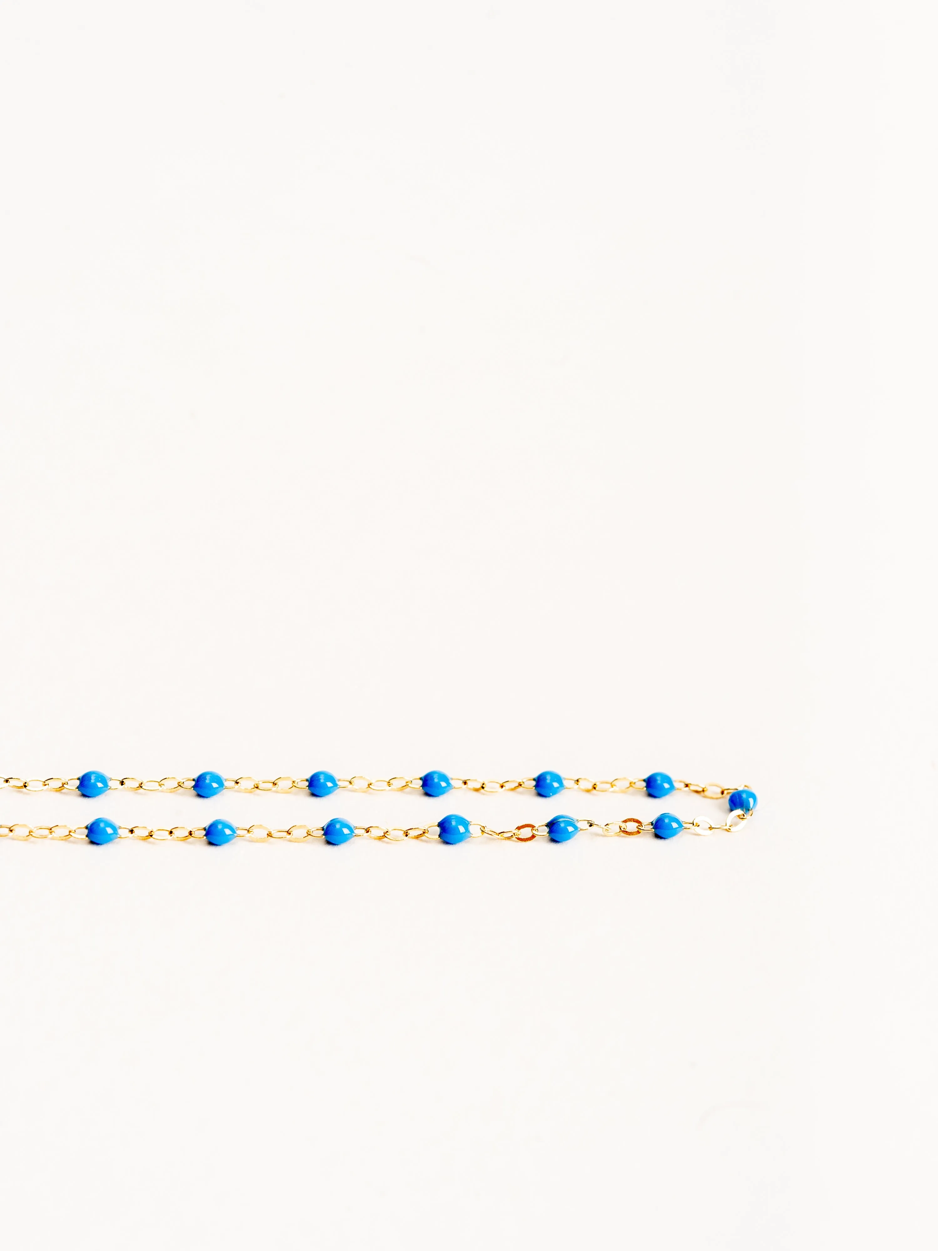 blue bead necklace- yellow gold