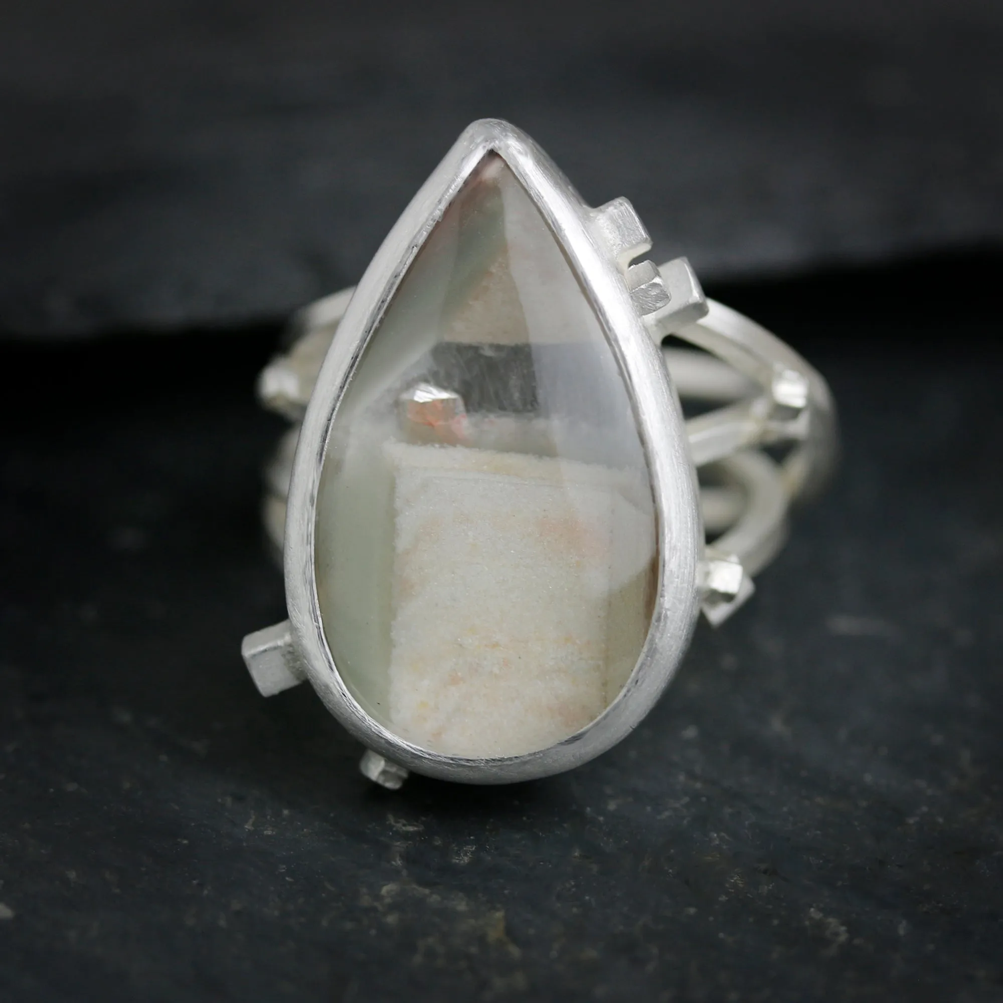 Included Quartz on a Square Wire Swirled Band. Size 7 1/4.