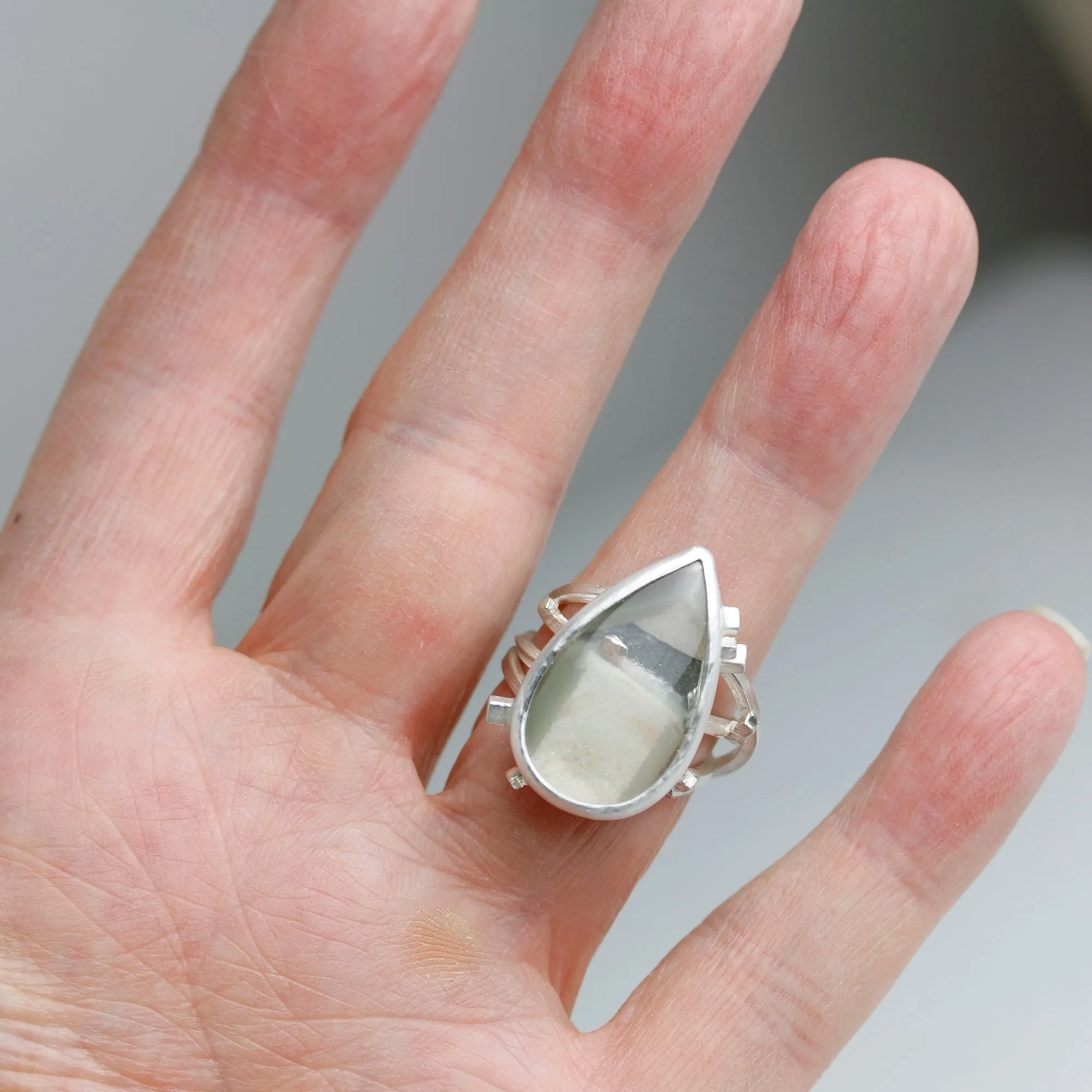 Included Quartz on a Square Wire Swirled Band. Size 7 1/4.