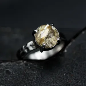 Round faceted golden rutilated quartz ring in silver bezel and prongs setting with sterling silver texture oxidized band